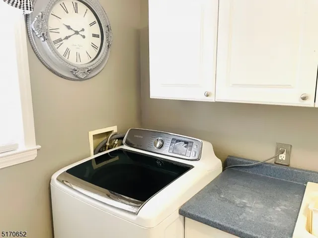 a close view of utility room with washer and dryer