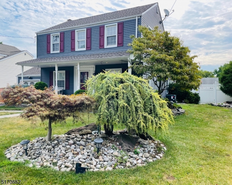 57 Russell Avenue Rahway, NJ 07065 - Photo 2 of 20 a front view of a house with a yard