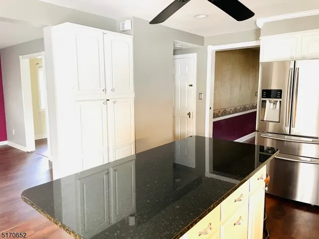 a kitchen with stainless steel appliances a refrigerator and a stove