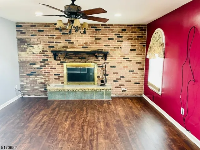 a view of a fireplace with wooden floor