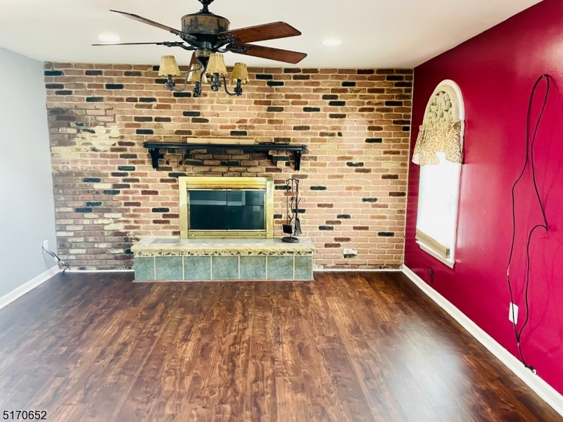 57 Russell Avenue Rahway, NJ 07065 - Photo 7 of 20 a view of a fireplace with wooden floor