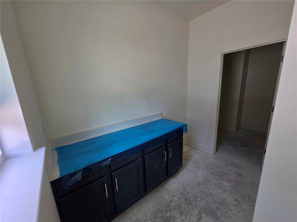 3844 Daybreak Run Loop Spring Hill, FL 34609 - Photo 6 of 11 a room with storage and utility