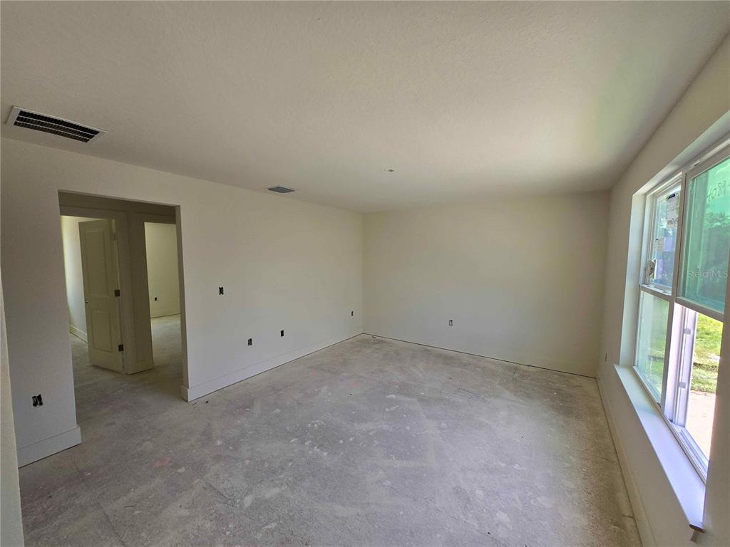 3844 Daybreak Run Loop Spring Hill, FL 34609 - Photo 7 of 11 an empty room with windows