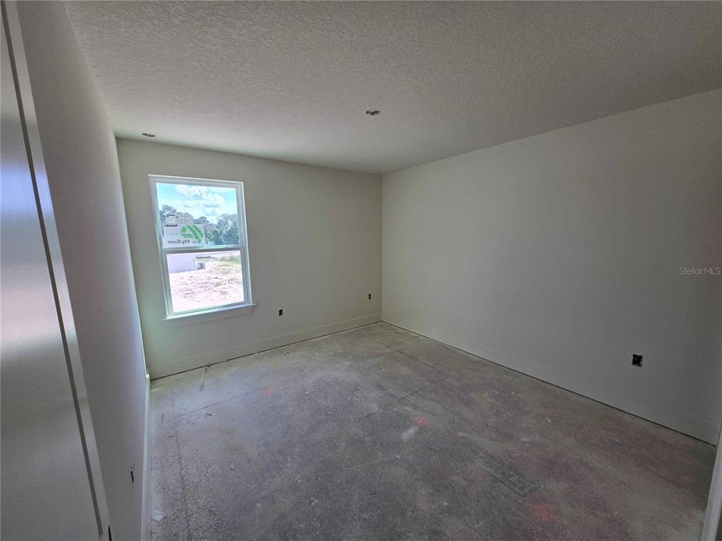 3844 Daybreak Run Loop Spring Hill, FL 34609 - Photo 8 of 11 an empty room with windows