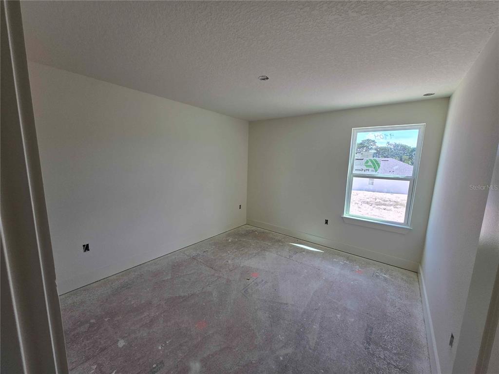 3844 Daybreak Run Loop Spring Hill, FL 34609 - Photo 10 of 11 an empty room with a window