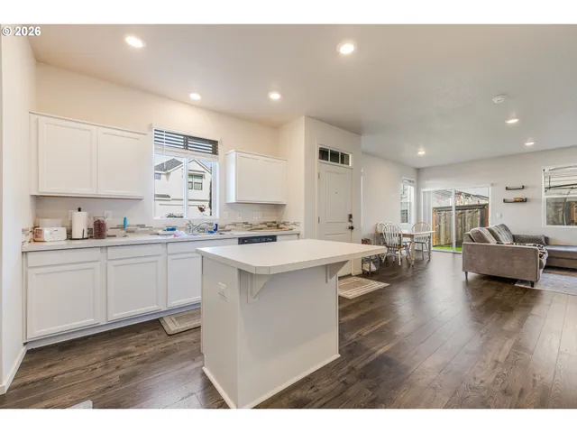 a open kitchen with sink and cabinets