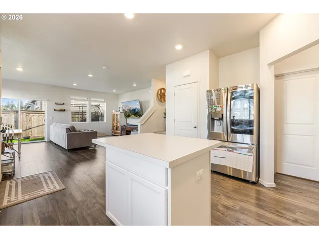 a view of living room with furniture and wooden floor