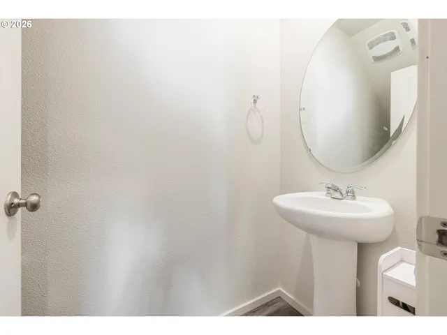 a bathroom with a sink and mirror