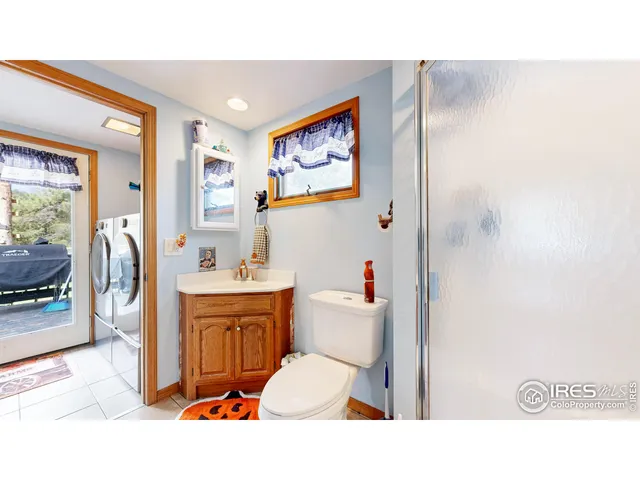 a bathroom with a sink vanity and mirror