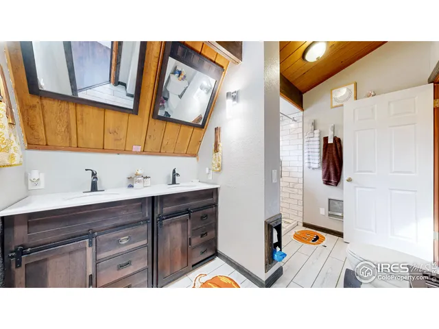 a room with lots of furniture and wooden floors