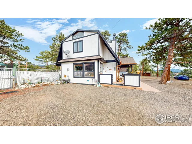 a bird view of a house with a yard