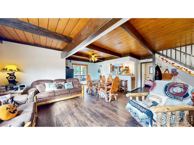 a living room with lots of furniture and lots of furniture