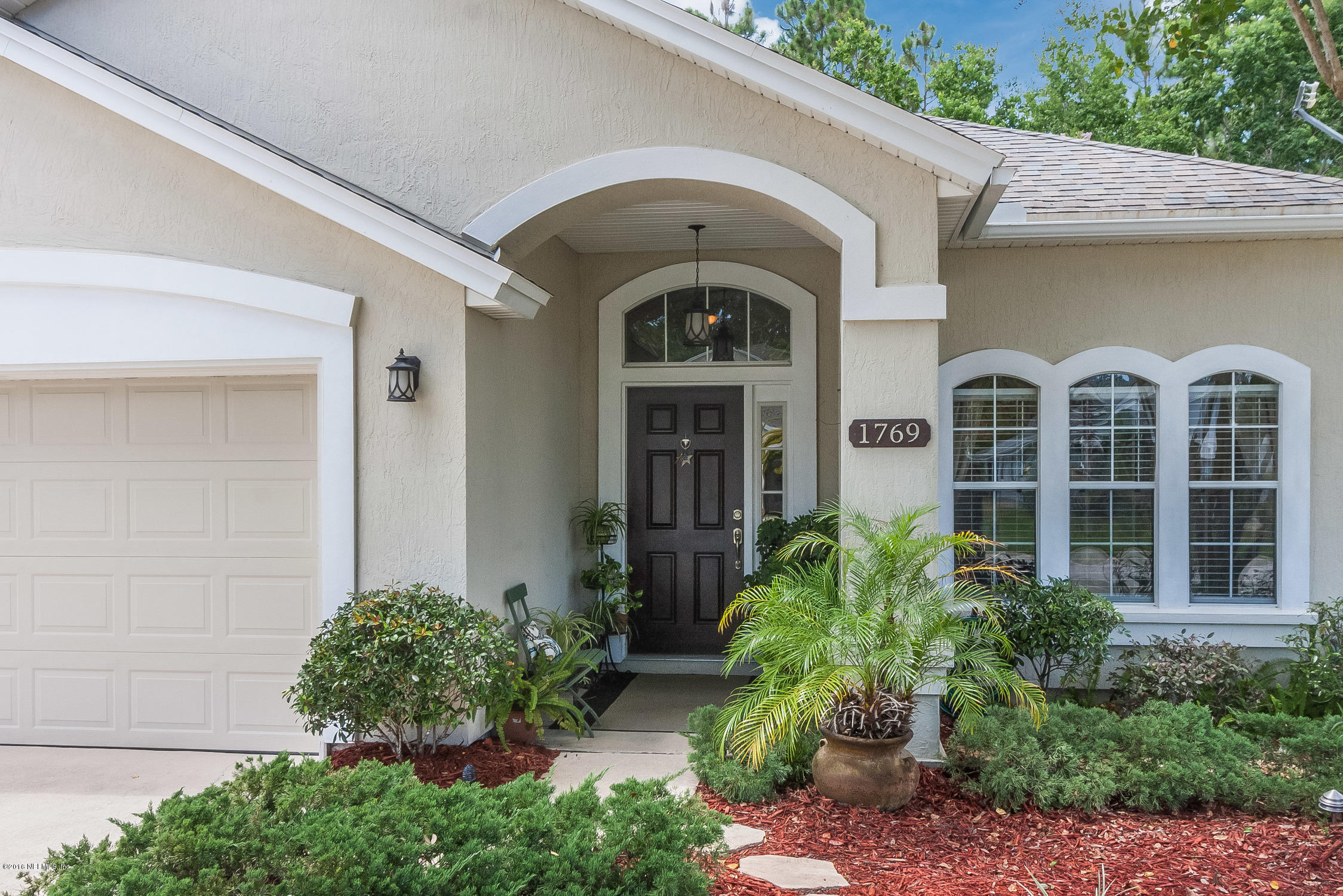 1769 Keswick Road St. Augustine, FL 32084 - Photo 7 of 31 a front view of a house with garden