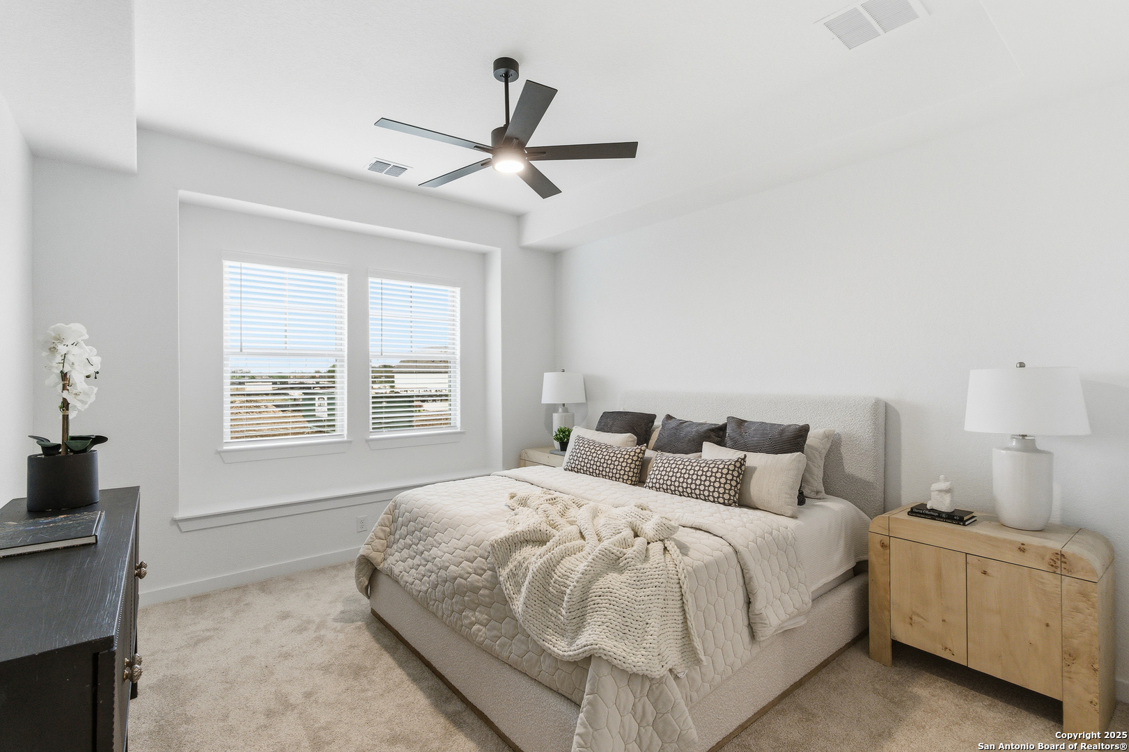 9426 Chatside Schertz, TX 78154 - Photo 11 of 44 a bedroom with a large bed and a window