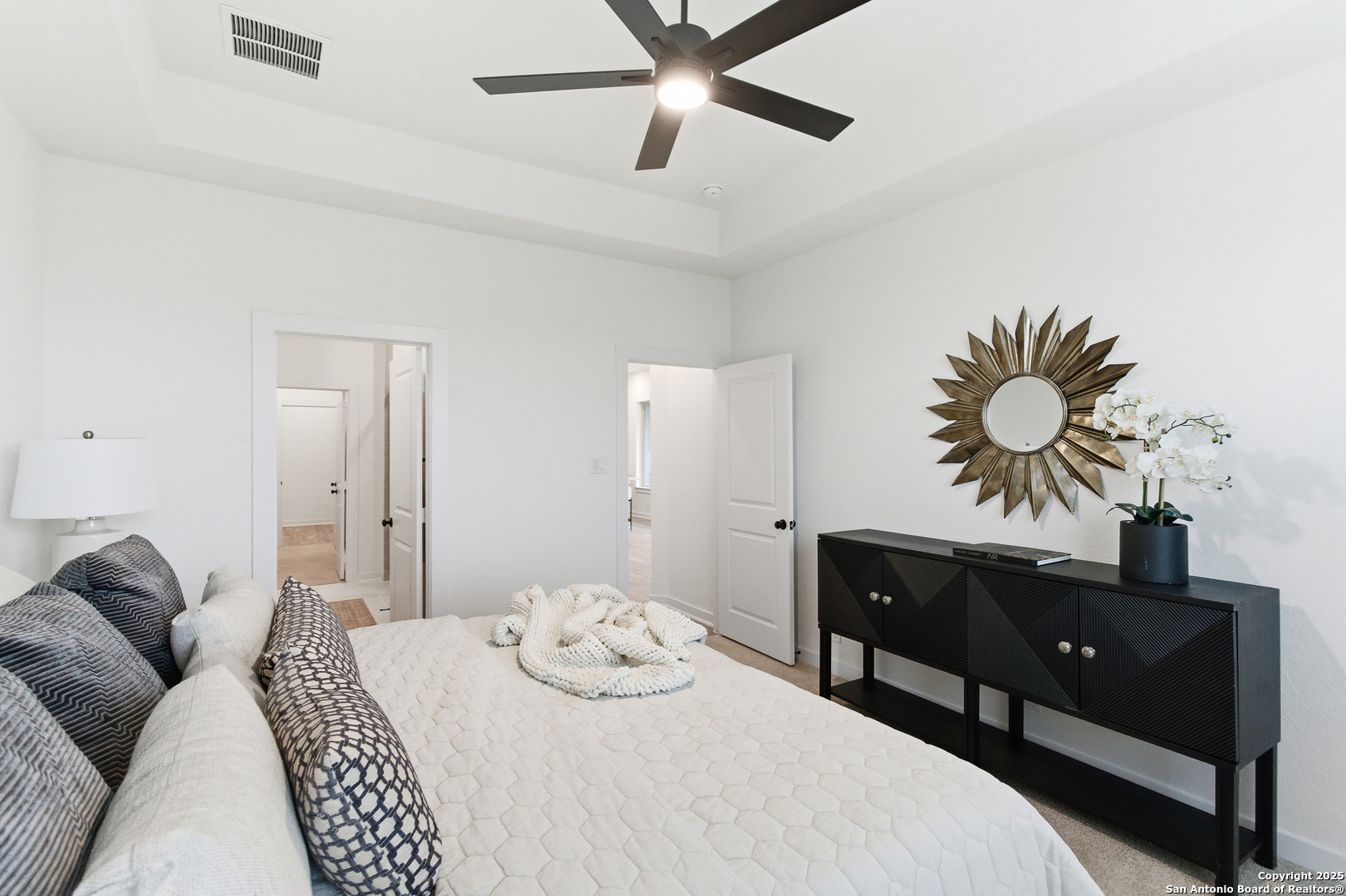 9426 Chatside Schertz, TX 78154 - Photo 12 of 44 a bedroom with a bed and ceiling fan