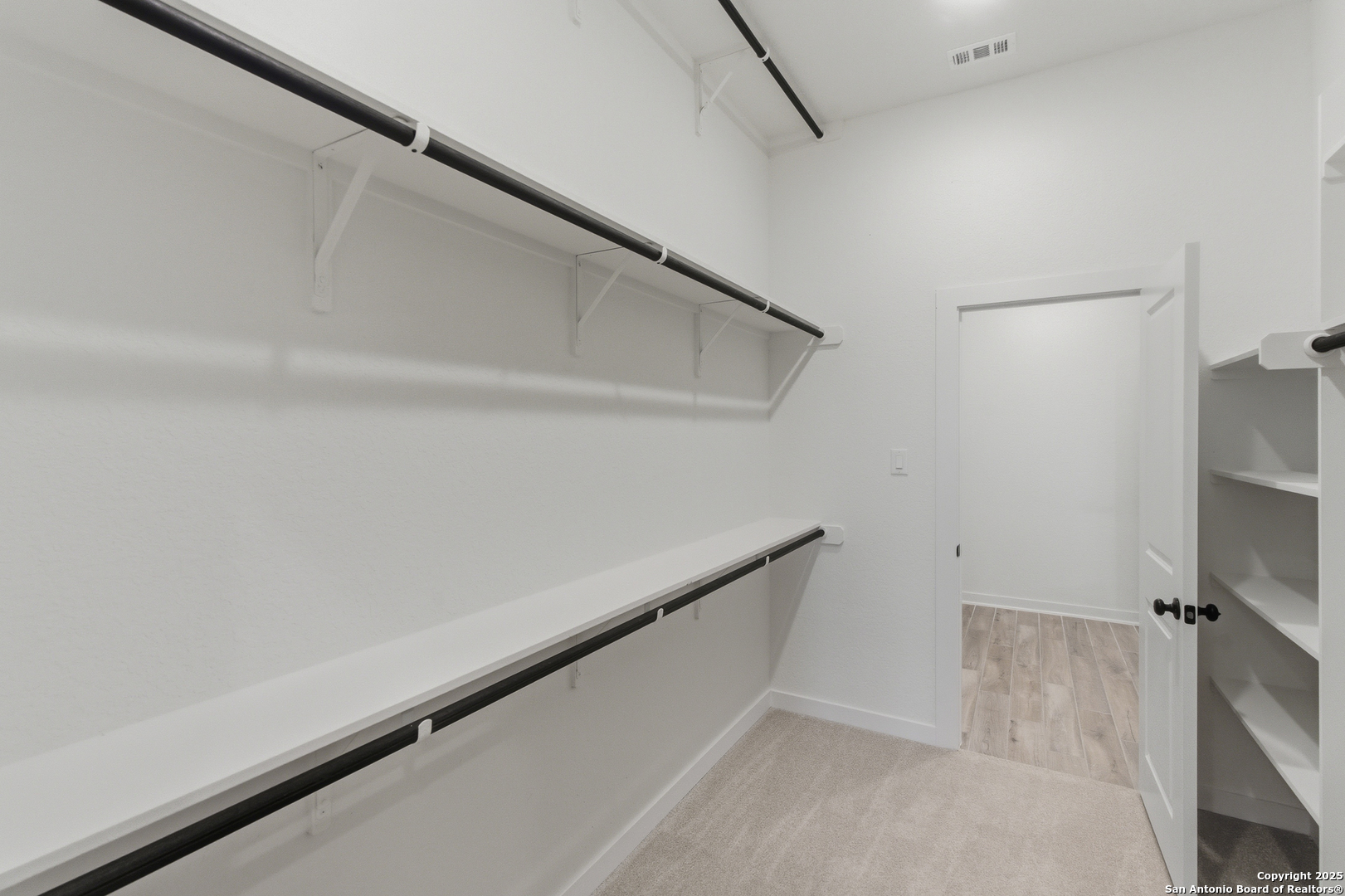 9426 Chatside Schertz, TX 78154 - Photo 16 of 44 a view of a room with racks on the wall