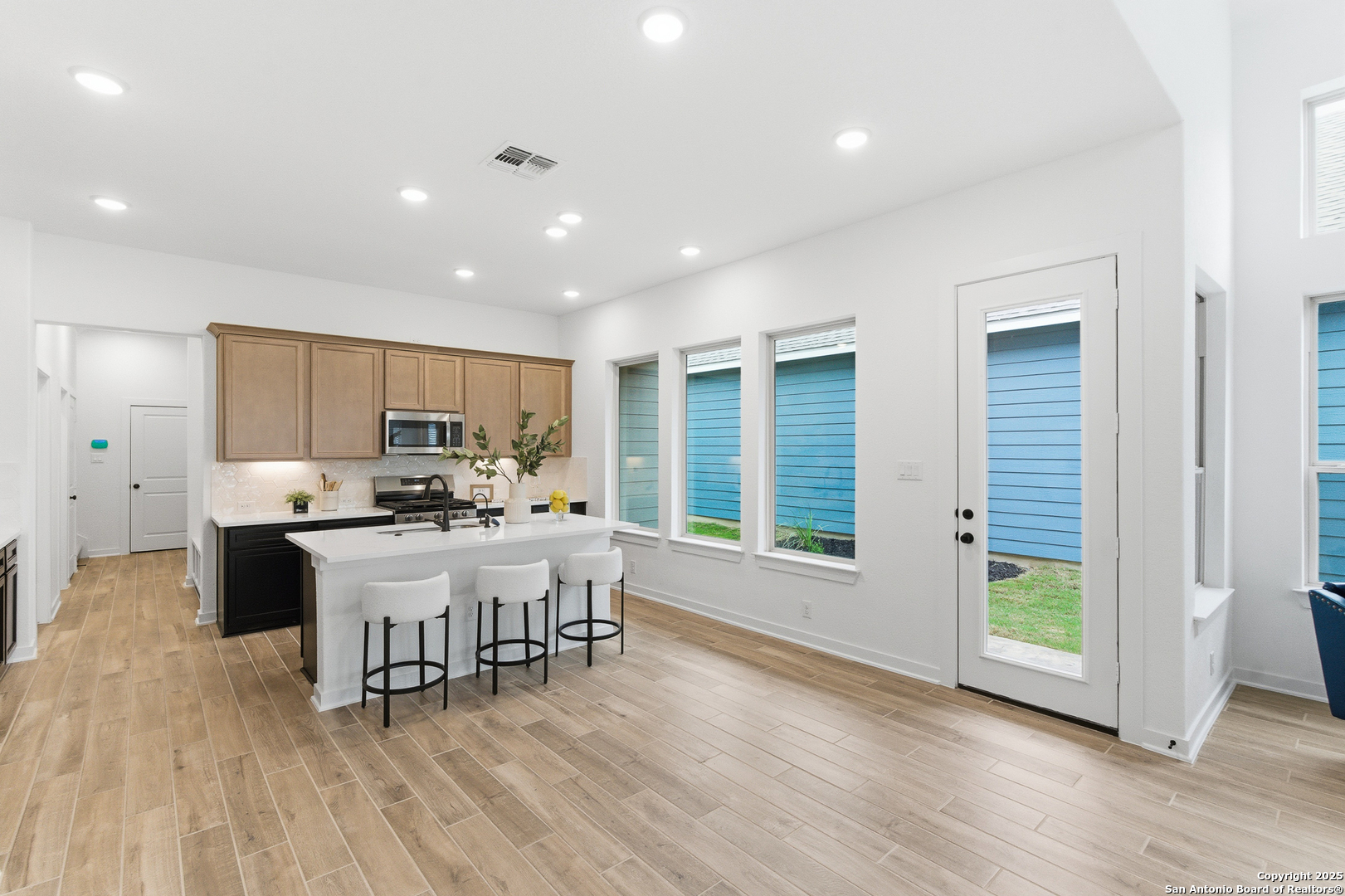 9426 Chatside Schertz, TX 78154 - Photo 19 of 44 a view of a dining room with furniture window and wooden floor