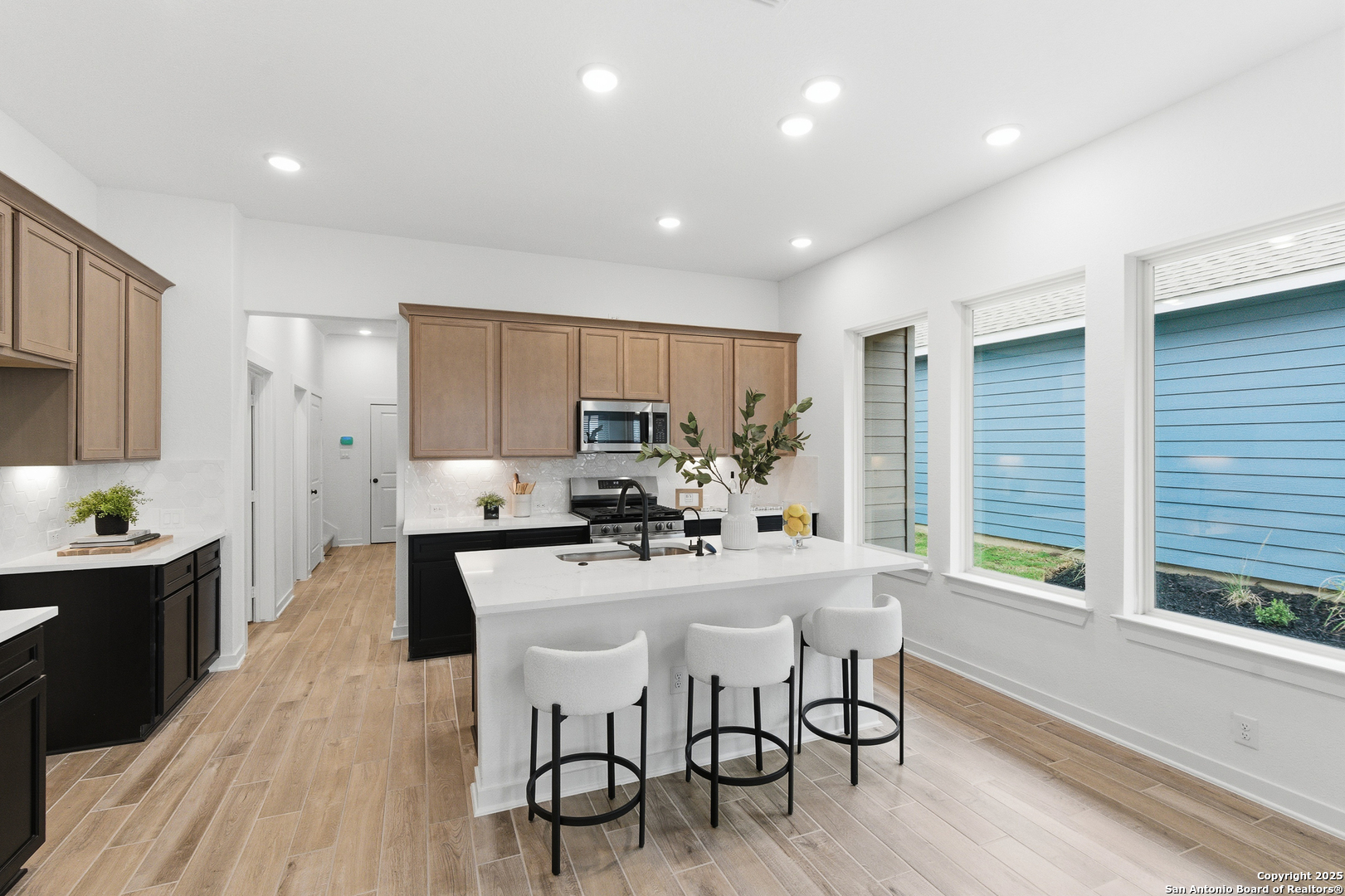 9426 Chatside Schertz, TX 78154 - Photo 23 of 44 a kitchen with a table chairs refrigerator and cabinets