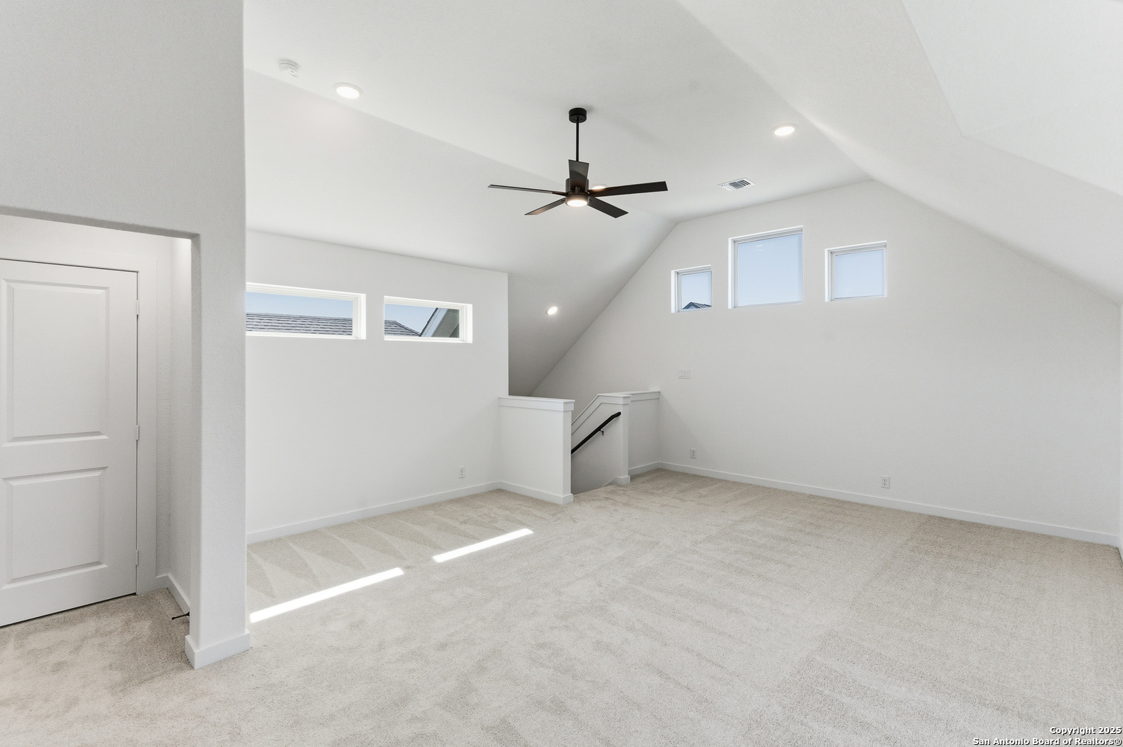 9426 Chatside Schertz, TX 78154 - Photo 29 of 44 an empty room with a ceiling fan and windows