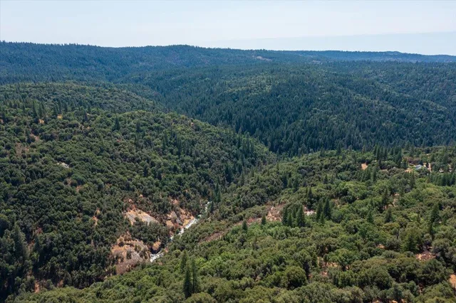 an aerial view of residential house and green space