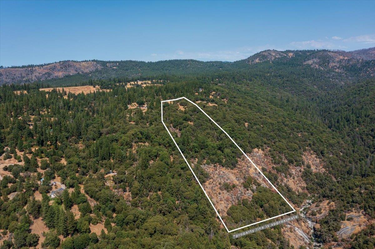 5421 Hawkeye Road Somerset, CA 95684 - Photo 13 of 17 a view of a city from a balcony with two lush green forest