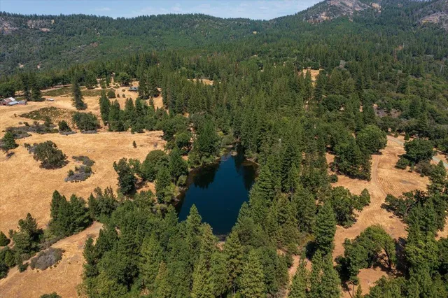 a view of lake with green space