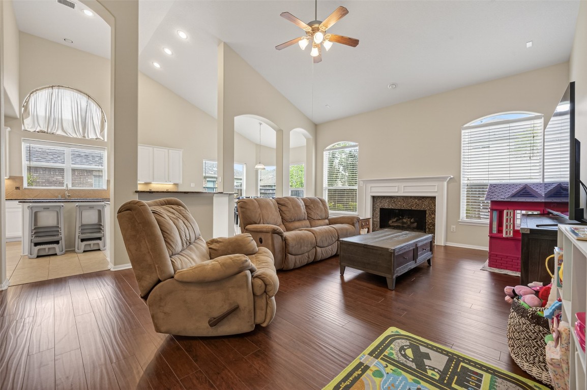 3219 Legends Mist Drive Spring, TX 77386 - Photo 12 of 50 a living room with furniture fireplace and wooden floor