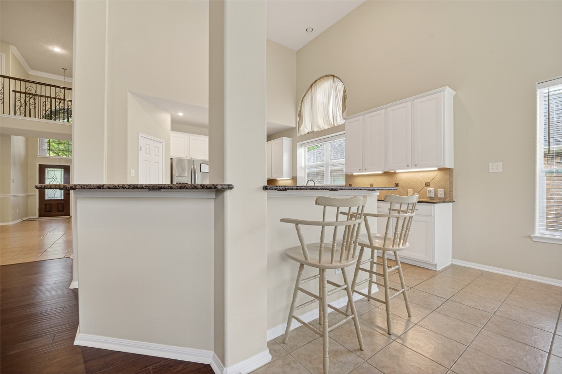 3219 Legends Mist Drive Spring, TX 77386 - Photo 15 of 50 a kitchen with stainless steel appliances a refrigerator and cabinets