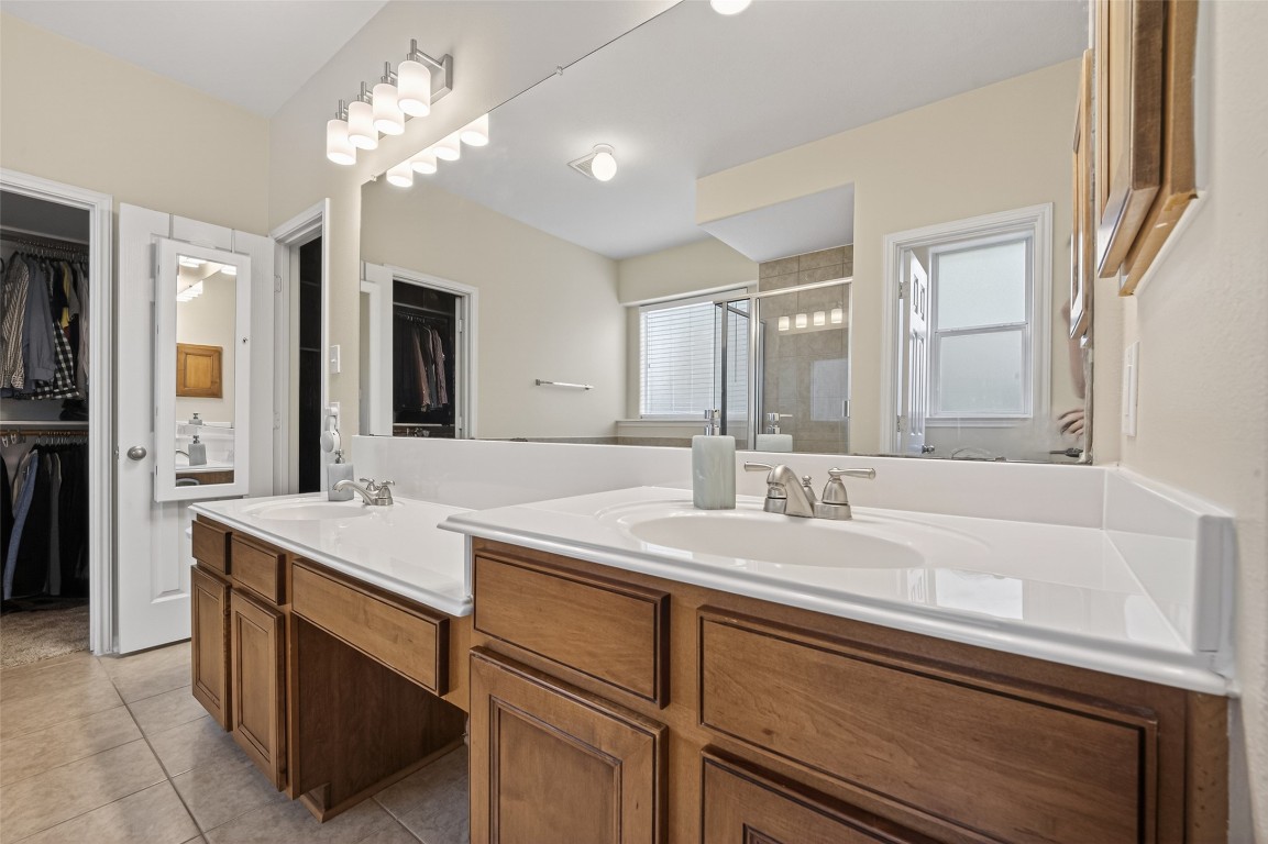 3219 Legends Mist Drive Spring, TX 77386 - Photo 29 of 50 a bathroom with a sink a vanity and a mirror