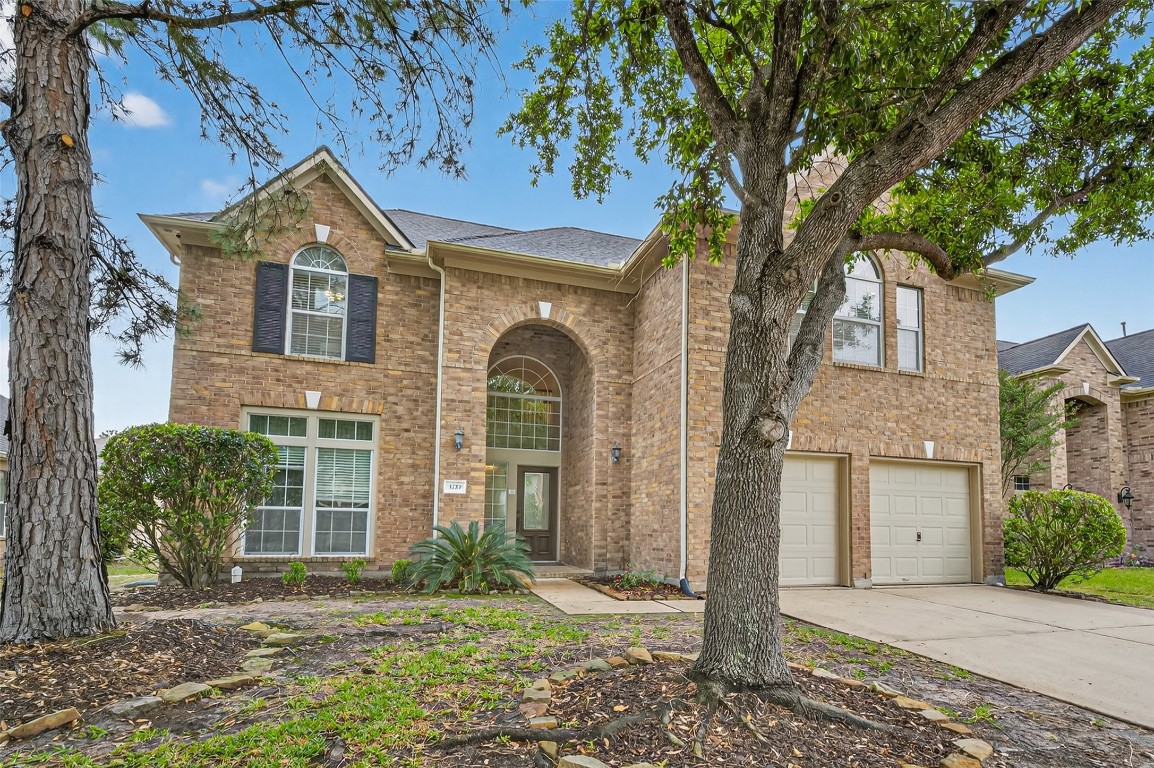 3219 Legends Mist Drive Spring, TX 77386 - Photo 3 of 50 a front view of a house with garden