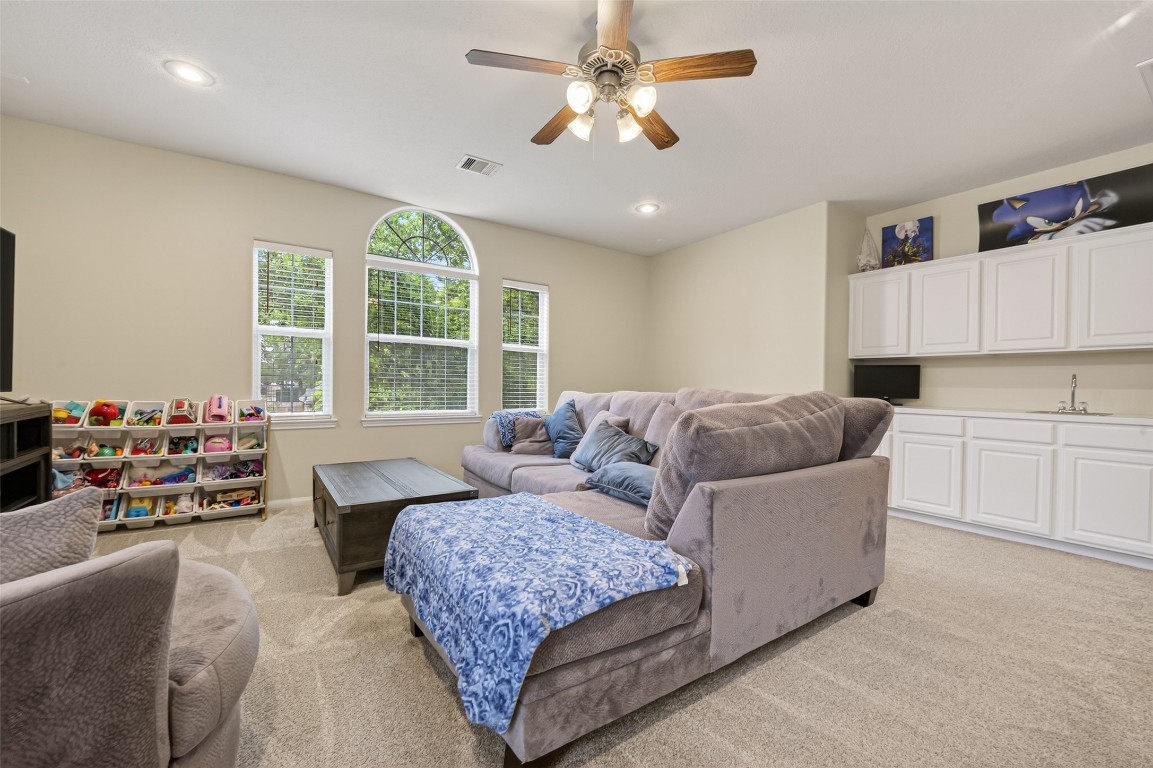 3219 Legends Mist Drive Spring, TX 77386 - Photo 33 of 50 a living room with furniture and a large window