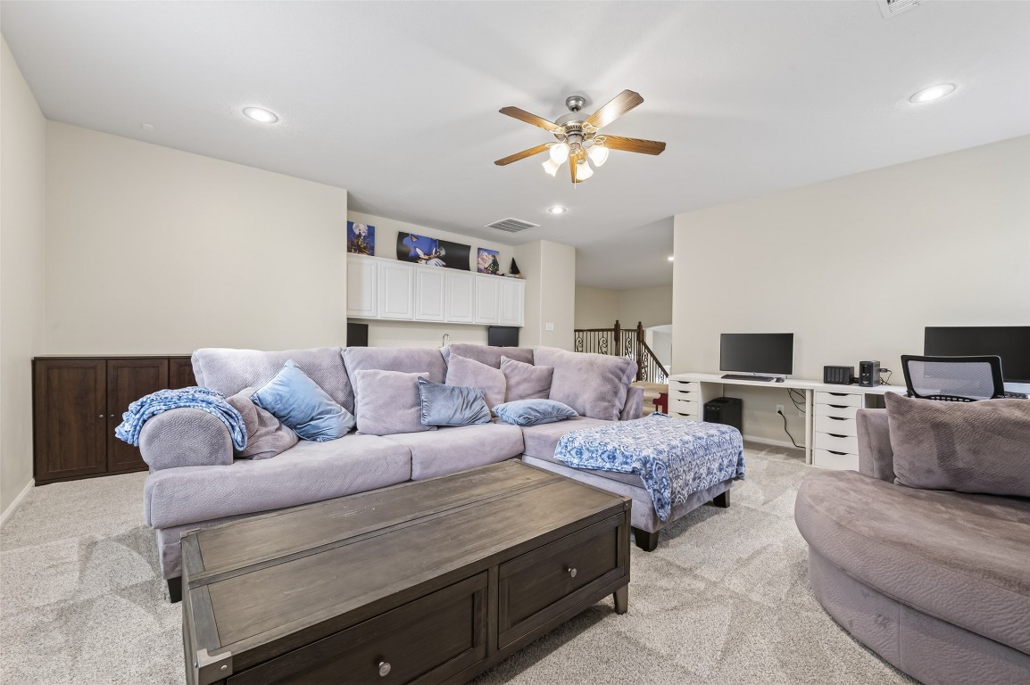 3219 Legends Mist Drive Spring, TX 77386 - Photo 34 of 50 a living room with furniture and a flat screen tv