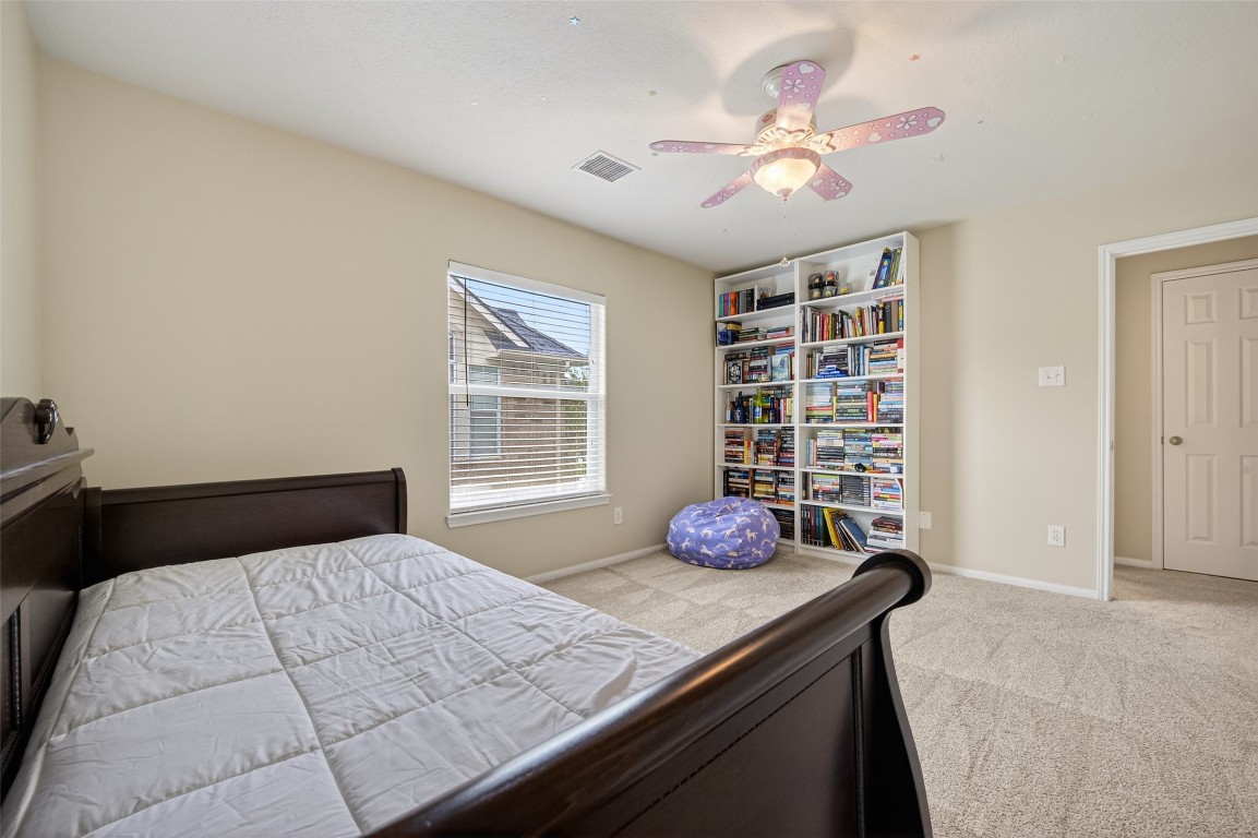 3219 Legends Mist Drive Spring, TX 77386 - Photo 37 of 50 a bedroom with a bed and window