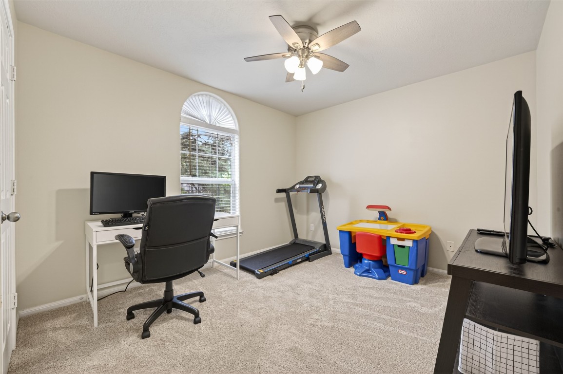 3219 Legends Mist Drive Spring, TX 77386 - Photo 39 of 50 a view of a workspace with furniture and a window