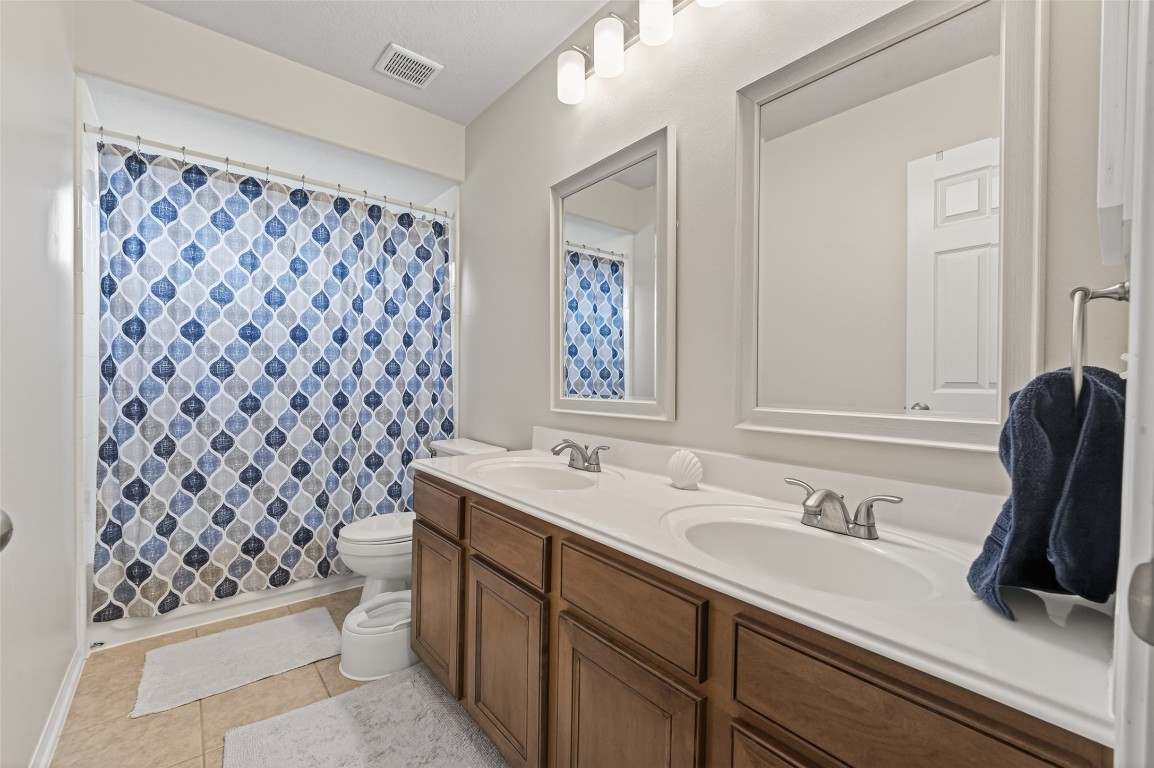 3219 Legends Mist Drive Spring, TX 77386 - Photo 41 of 50 a bathroom with a sink toilet and shower