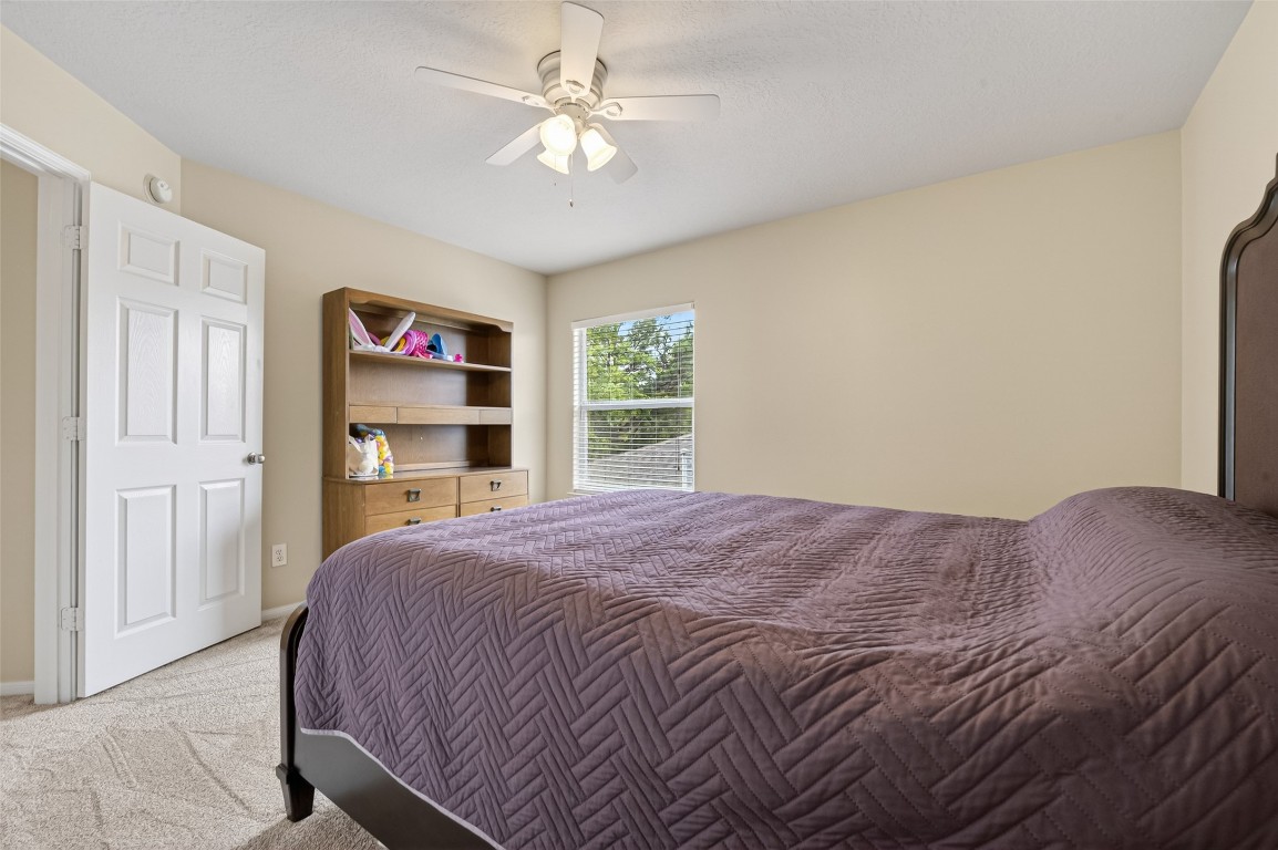 3219 Legends Mist Drive Spring, TX 77386 - Photo 43 of 50 a bedroom with a bed dresser and a window