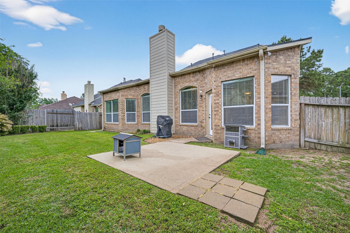 3219 Legends Mist Drive Spring, TX 77386 - Photo 45 of 50 a view of a house with a yard and sitting area