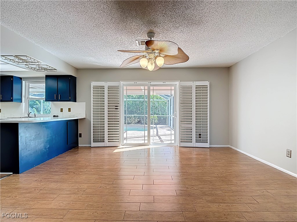 5946 Stringfellow Road St. James City, FL 33956 - Photo 22 of 50 a view of a kitchen with microwave and cabinets