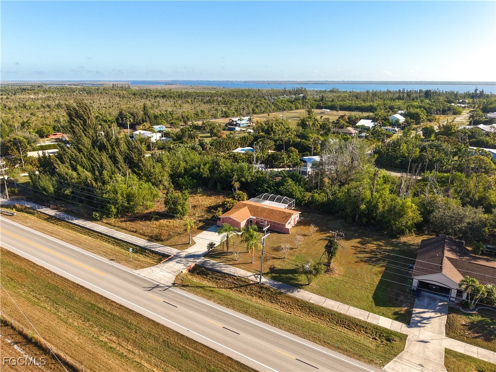 5946 Stringfellow Road St. James City, FL 33956 - Photo 3 of 50 an aerial view of residential houses with outdoor space