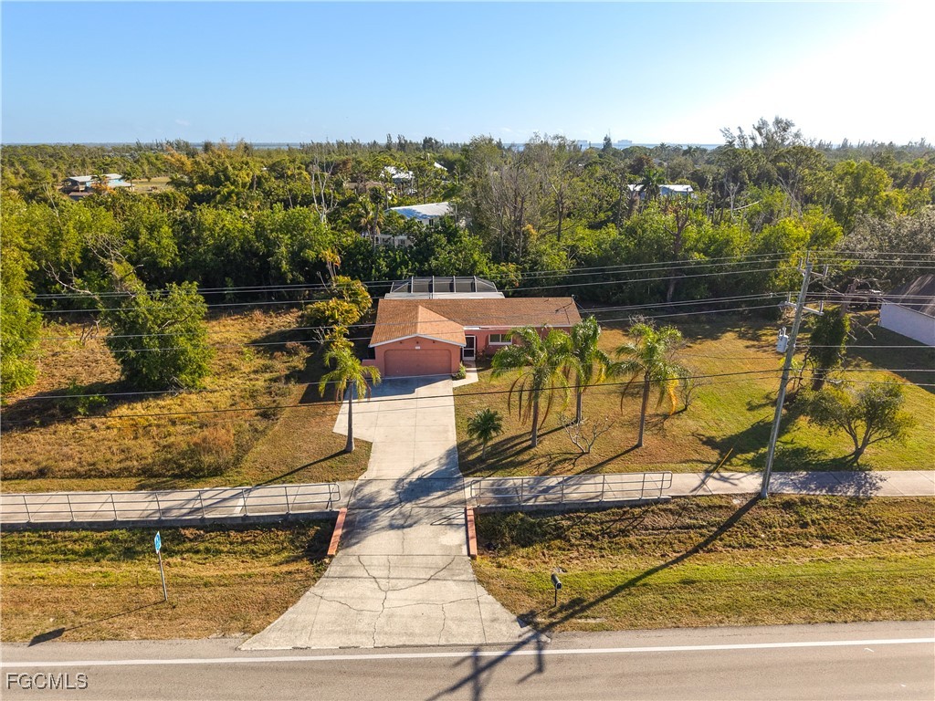 5946 Stringfellow Road St. James City, FL 33956 - Photo 4 of 50 a view of a swimming pool with a lake view