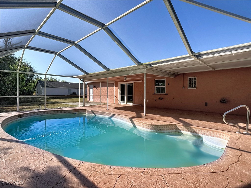 5946 Stringfellow Road St. James City, FL 33956 - Photo 44 of 50 a swimming pool with outdoor seating