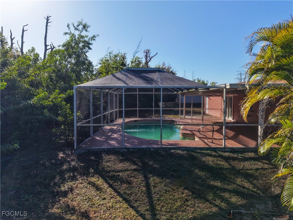 5946 Stringfellow Road St. James City, FL 33956 - Photo 46 of 50 a view of a house with backyard and sitting area