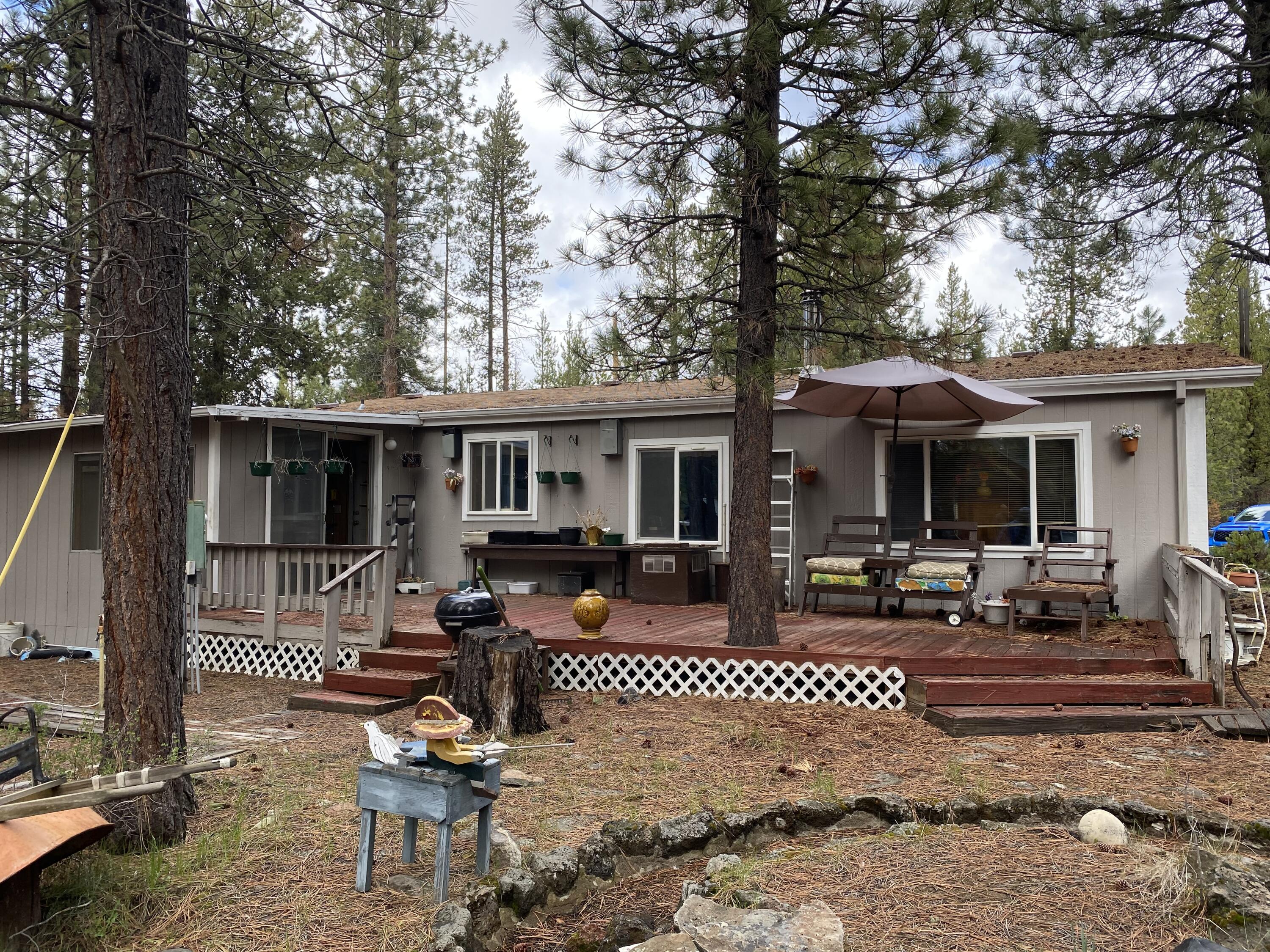 52401 Ammon Road La Pine, OR 97739 - Photo 6 of 21 front view of a house with a patio