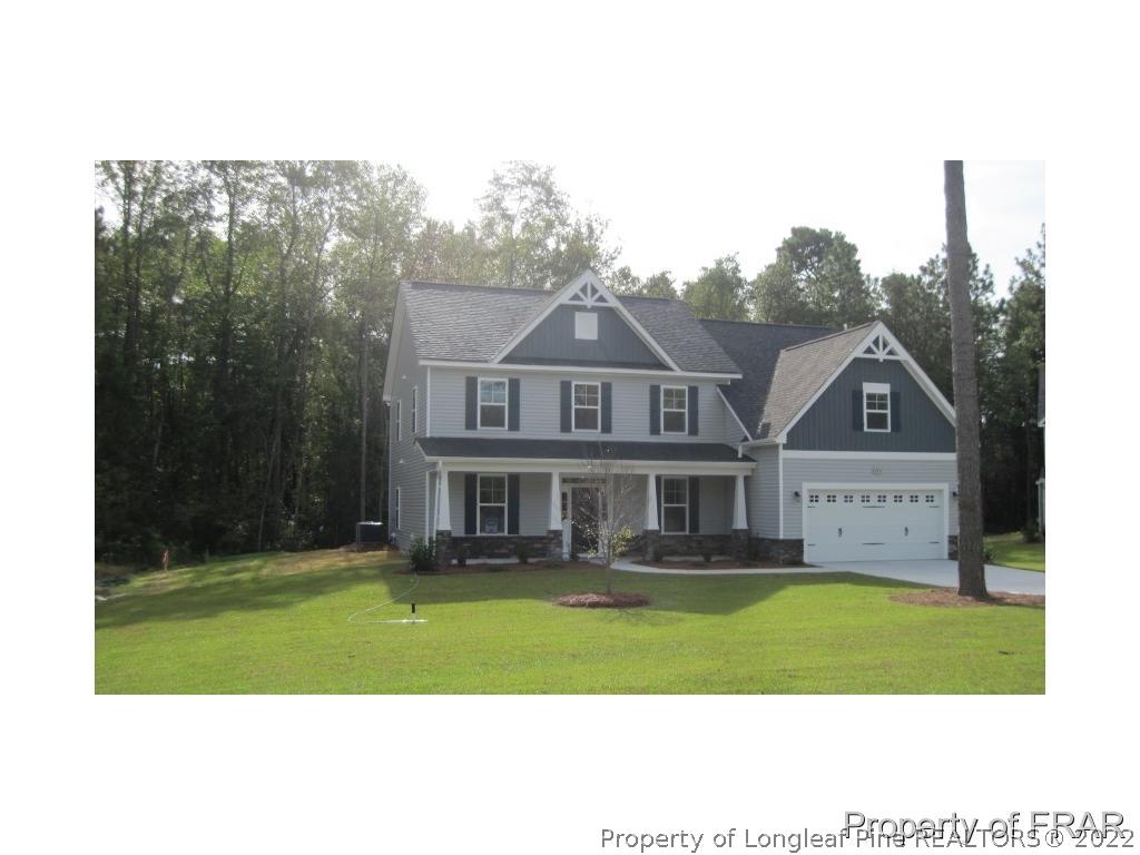 775 Sun Road Aberdeen, NC 28315 - Photo 1 of 17 a front view of a house with a yard