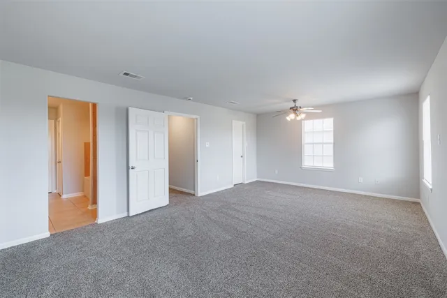 a view of empty room with windows