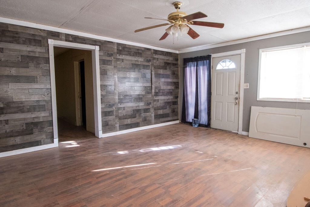2609 County Road 7110 Lubbock, TX 79404 - Photo 15 of 29 a view of empty room with wooden floor and fan