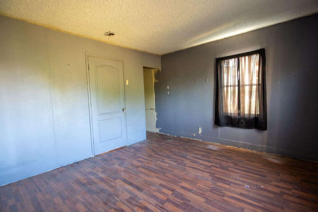 2609 County Road 7110 Lubbock, TX 79404 - Photo 17 of 29 a view of an empty room with wooden floor and window