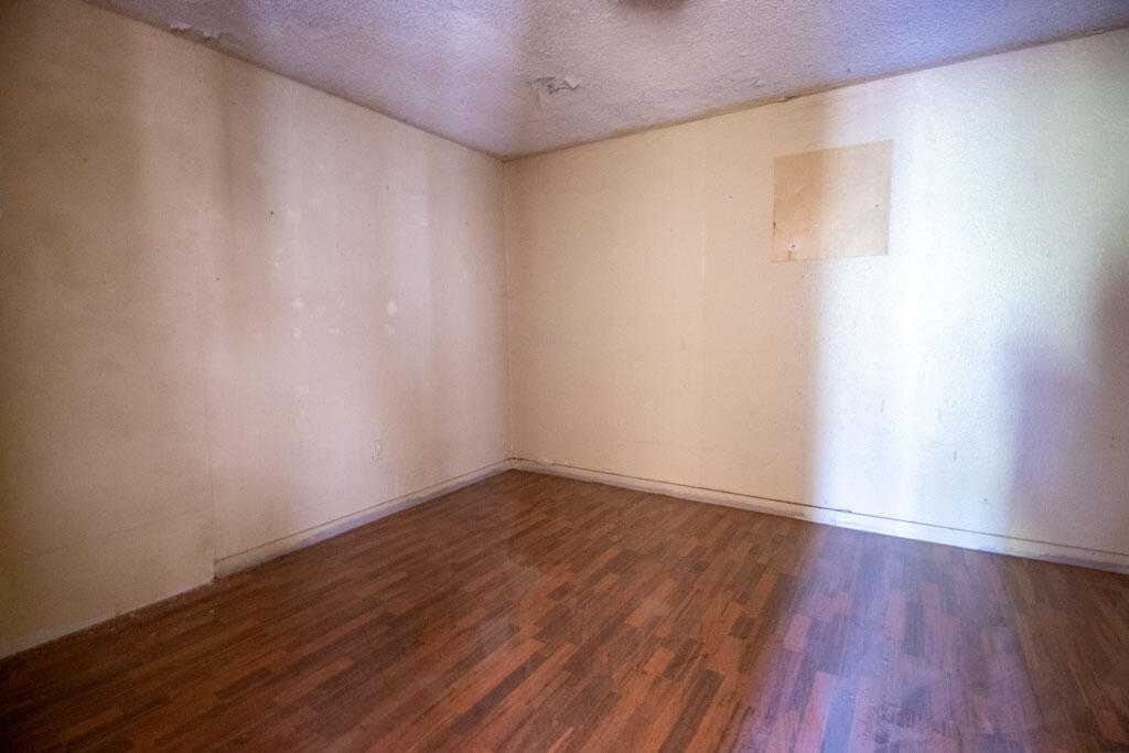 2609 County Road 7110 Lubbock, TX 79404 - Photo 19 of 29 a view of an empty room with wooden floor