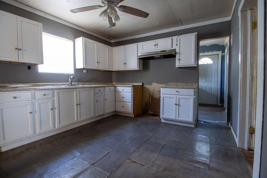 2609 County Road 7110 Lubbock, TX 79404 - Photo 26 of 29 a kitchen with stainless steel appliances granite countertop a sink and cabinets