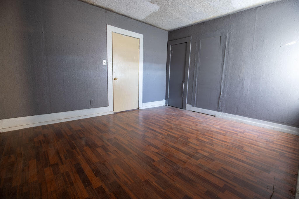 2609 County Road 7110 Lubbock, TX 79404 - Photo 27 of 29 a view of an empty room with wooden floor